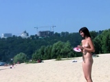 Bombastic young nudist babes sunbathe nude at the beach